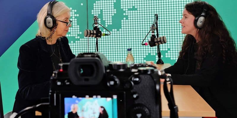 Marie Hyland and Mary McCaughey are sitting in a recording studio to record the podcast