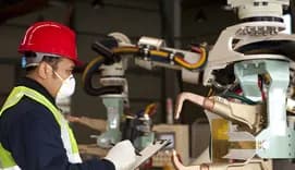 Technican checking robot machine