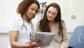 Nurse showing patient results