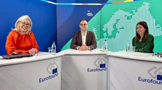 Three people in a studio setting facing the camera
